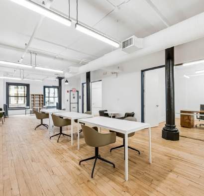 Work tables near a window and a cast-iron column
