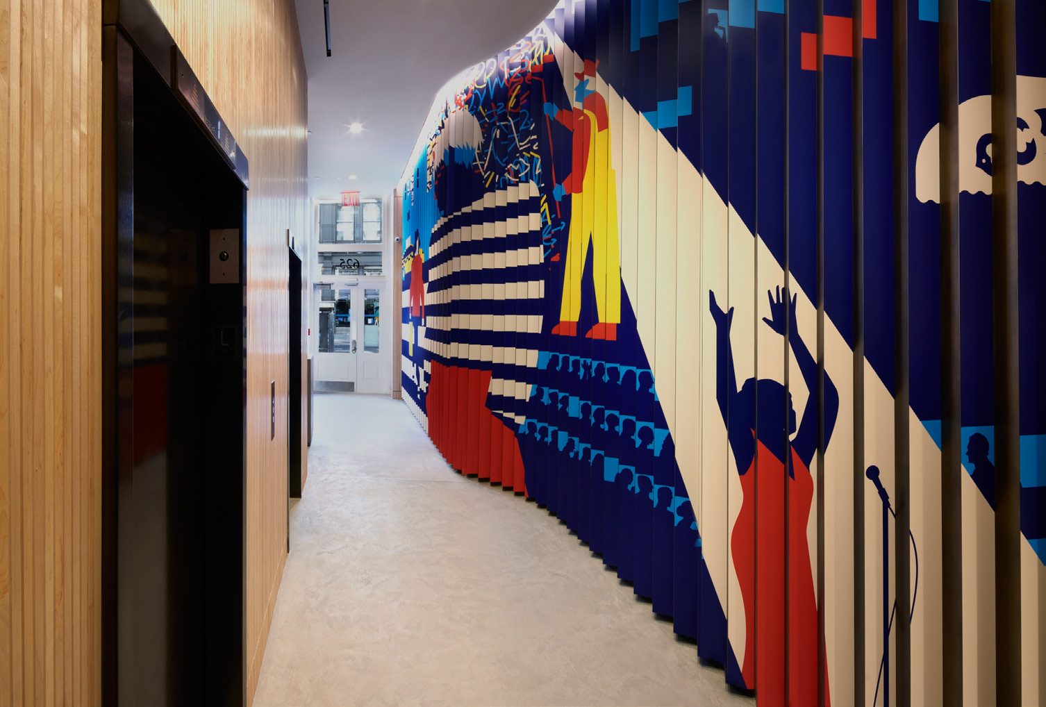Lobby corridor with a mural painted across vertical slats