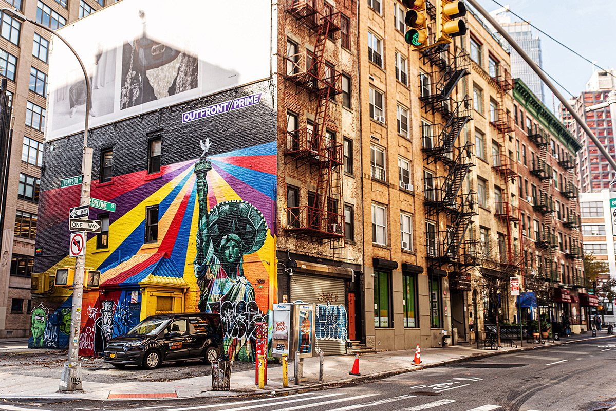 Colorful mural on the side of a brick building